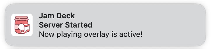 Screenshot of a macOS system notification from Jam Deck. The notification features the Jam Deck icon (a pink jar) and displays 'Server Started' as the header, followed by the message 'Now playing overlay is active!' The notification uses the standard macOS rounded rectangle design with a light gray background.